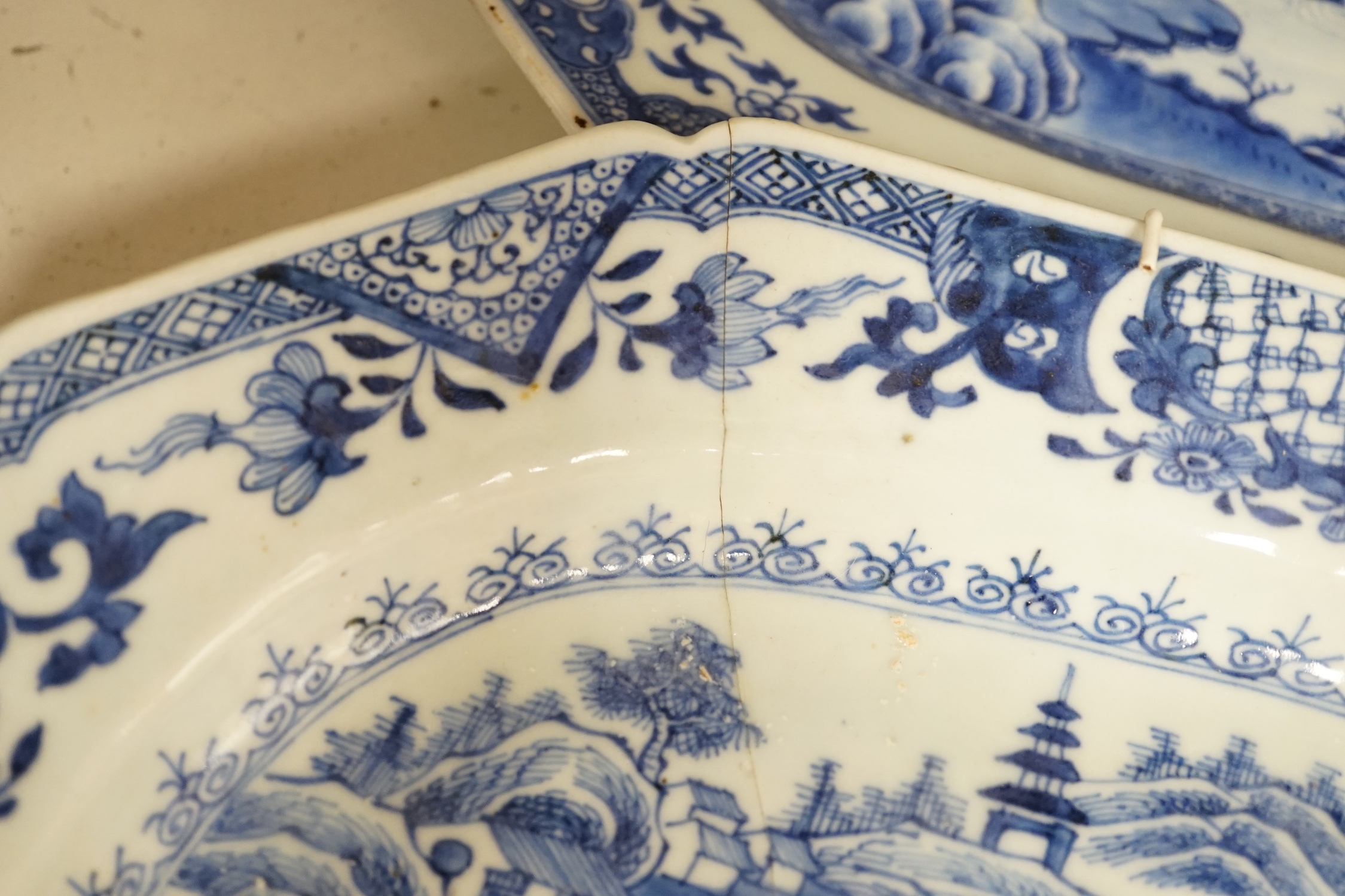 Three 18th century Chinese blue and white meat plates, largest, 41.5cm wide, 35cm deep (a.f.)